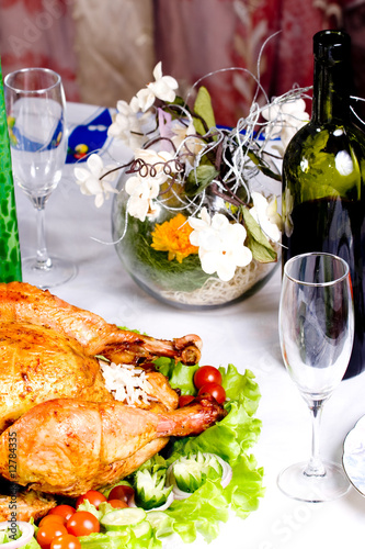 Feasting backed turkey on holiday table ready to eat