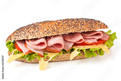 long whole wheat baguette sandwich with lettuce, tomatoes, ham,
