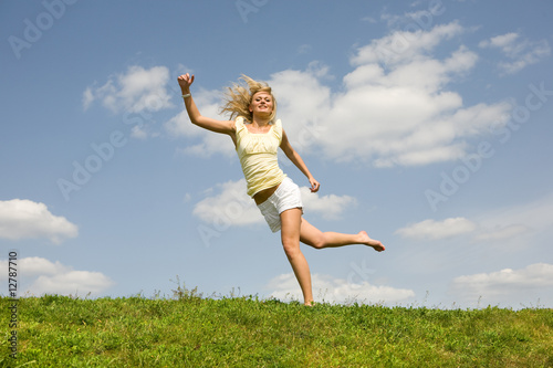 Happy young woman jumping © Eduard Stelmakh