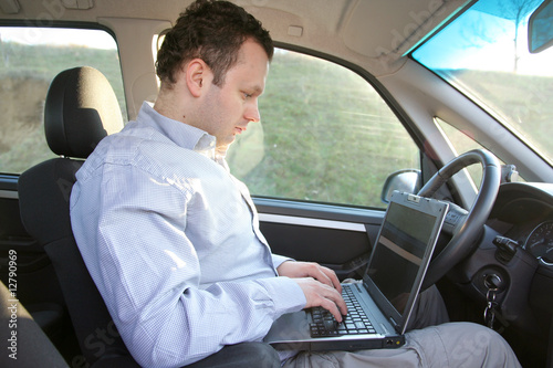 Laptop behind steering wheel © Vladimir Jovanovic