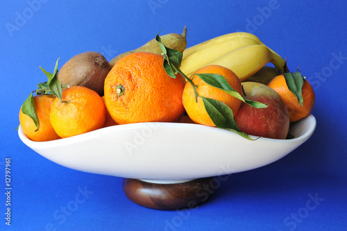 Fototapeta Naklejka Na Ścianę i Meble -  Tray table with seasonal ripe fruits over blue