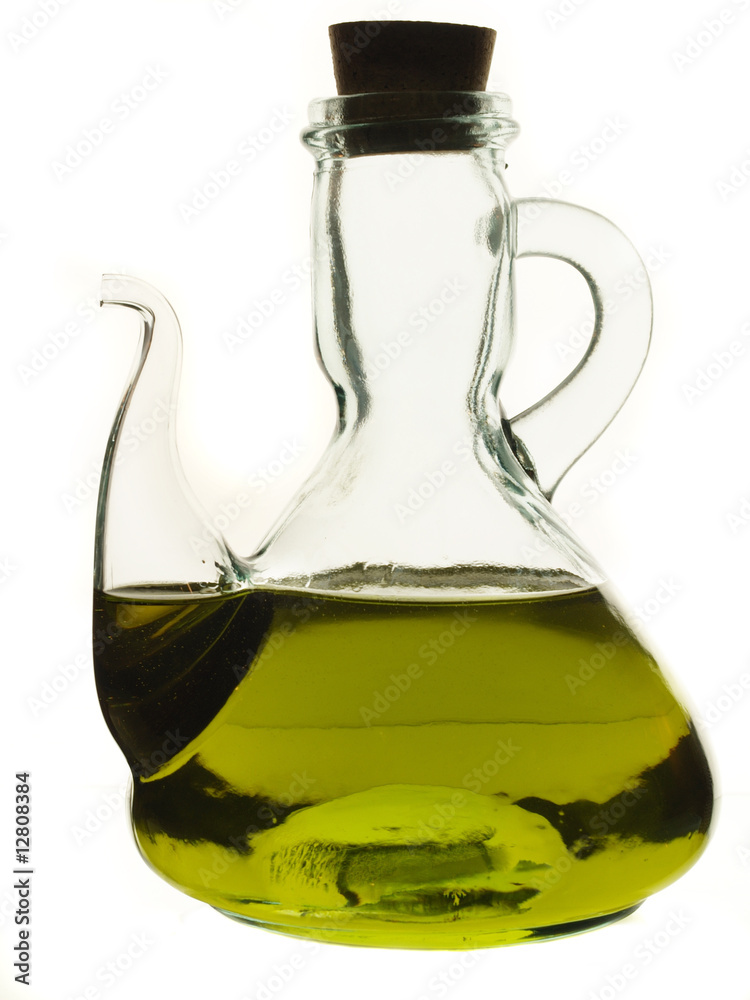 Glass jug with olive oil isolated on white Glass jug with olive oil isolated on white