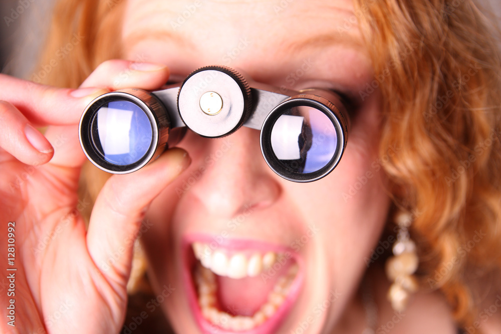 astonished woman with binoculars astonished woman with binoculars