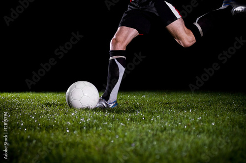 soccer player is going to kick the ball