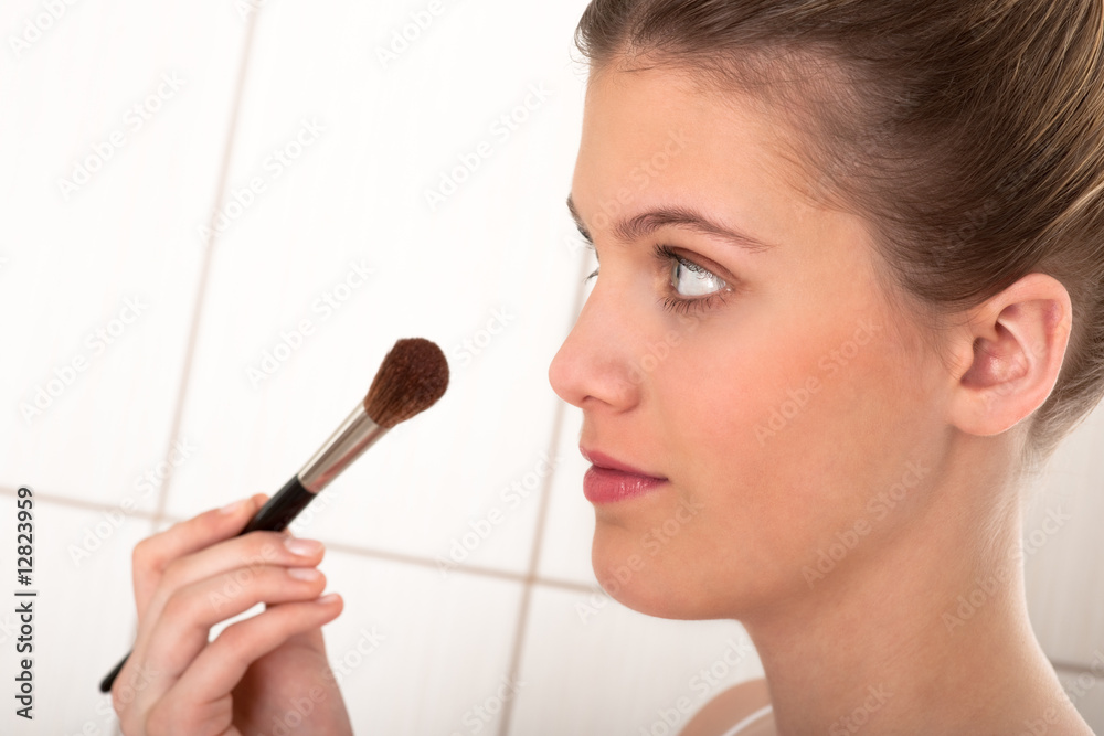 Body care series - Young lady applying powder