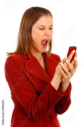 Young business woman shouting at the phone. Isolated on white.