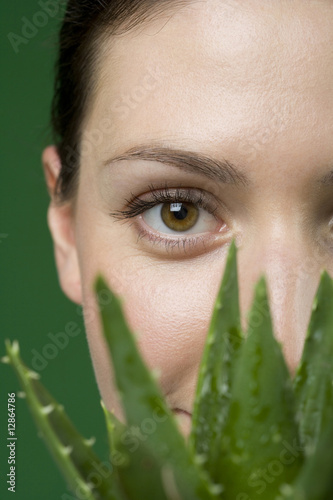 Close up woman and aloe plant