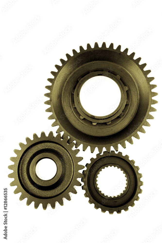 Three gears meshing together over white Three gears meshing together over white