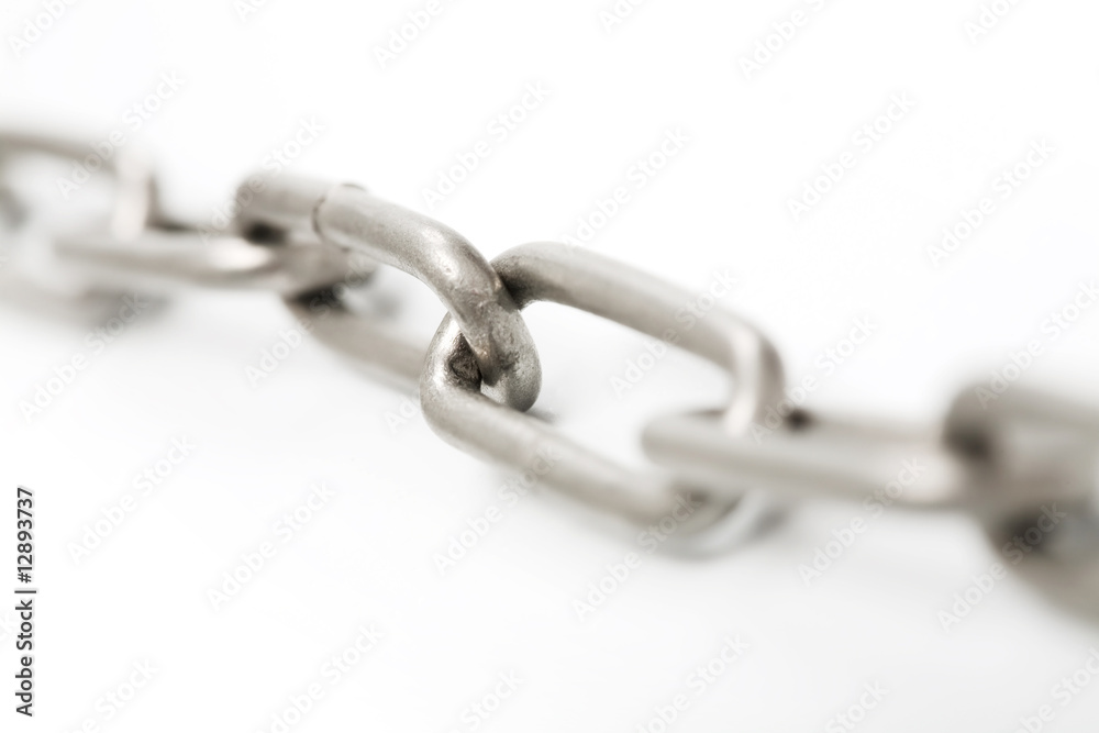 Macro shot of steel chain out of focus Macro shot of steel chain out of focus