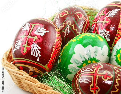 Group of painted Easter eggs in wooden basket (Extreme closeup)