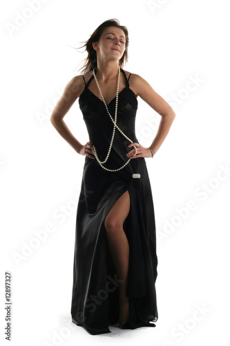 Girl in black dress isolated on white background