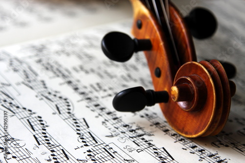 violin scroll and sheet music