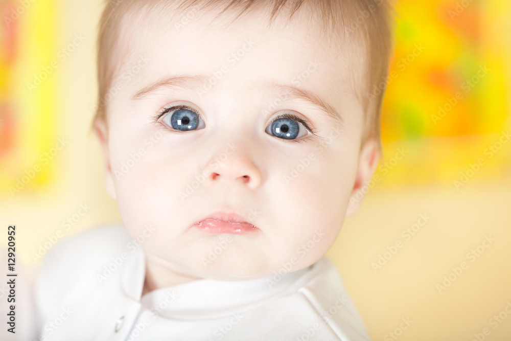 Portrait of pretty blue-eyes baby