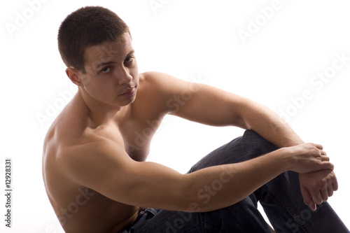 Young Sporty Man Doing Special Exercise on White Background