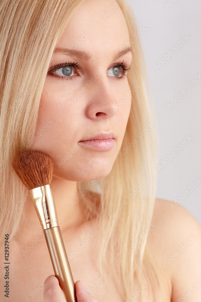 woman with make up brush woman with make up brush