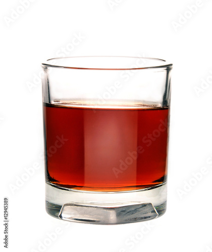 brandy in glass on white background