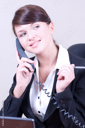 Portrait of young beautiful woman in office environment