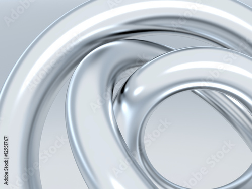 Abstract metallic rings on shined grey background