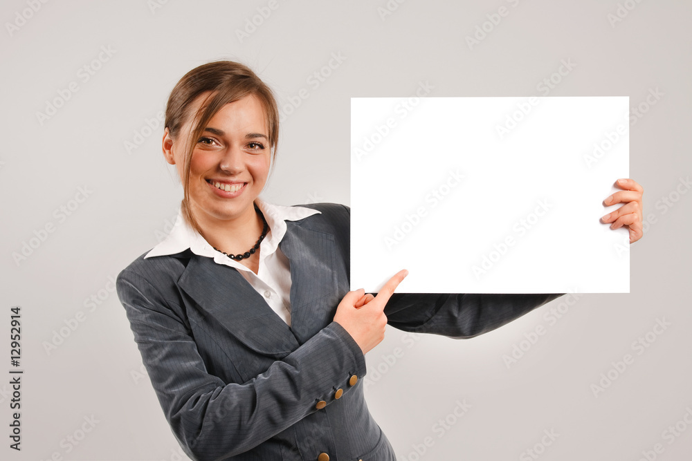 Businesswoman holding a blank page Businesswoman holding a blank page
