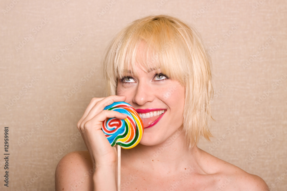Woman licking lollipop