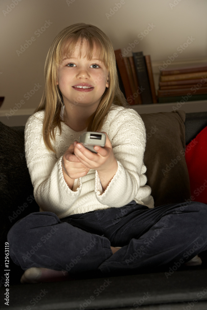 Young Girl Using Remote Control Young Girl Using Remote Control