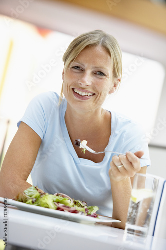 Woman Eating Lunch At A Cafe