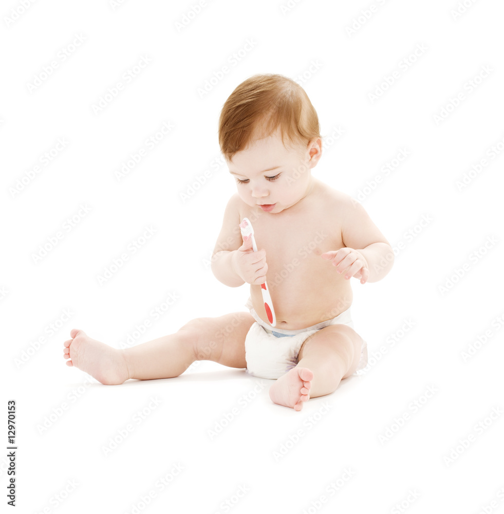 baby boy in diaper with toothbrush baby boy in diaper with toothbrush