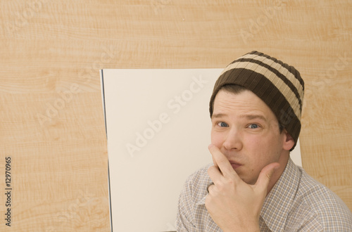 Artist Thinking at Drawing Table photo