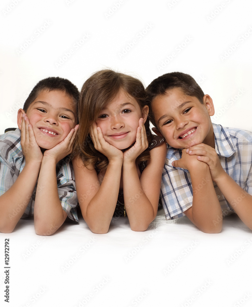 Adorable group shot of two boys and on little girl Adorable group shot of two boys and on little girl