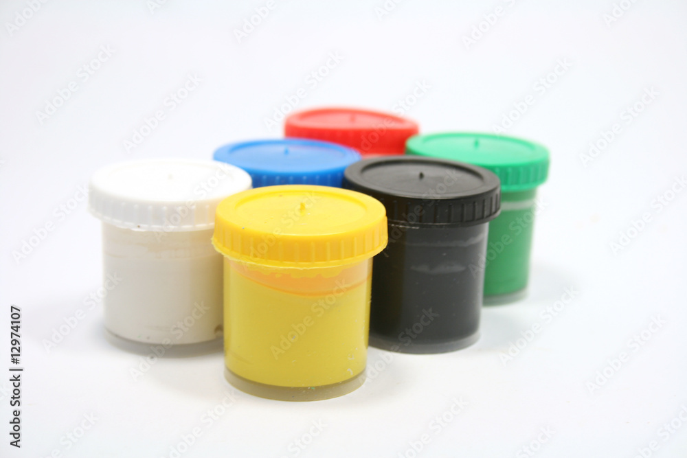 many paint jars with gouache on white background many paint jars with gouache on white background