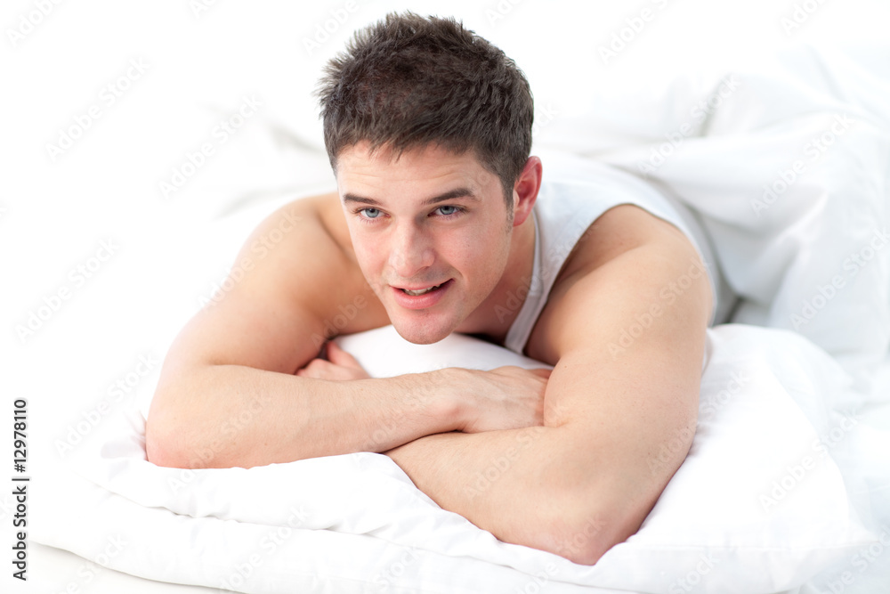 Man lying on bed awake Man lying on bed awake