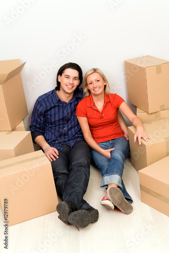 Couple sitting in new home © pikselstock