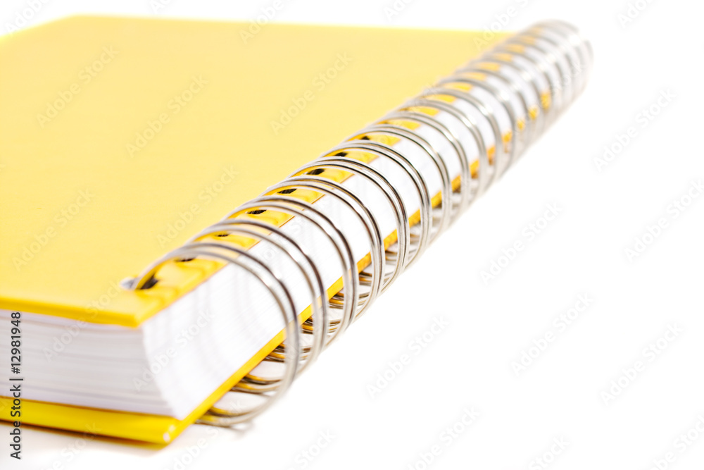 spiral joint of yellow diary book whitte background spiral joint of yellow diary book whitte background