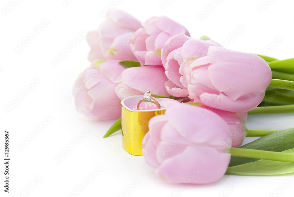 Ring and pink tulips isolated on white
