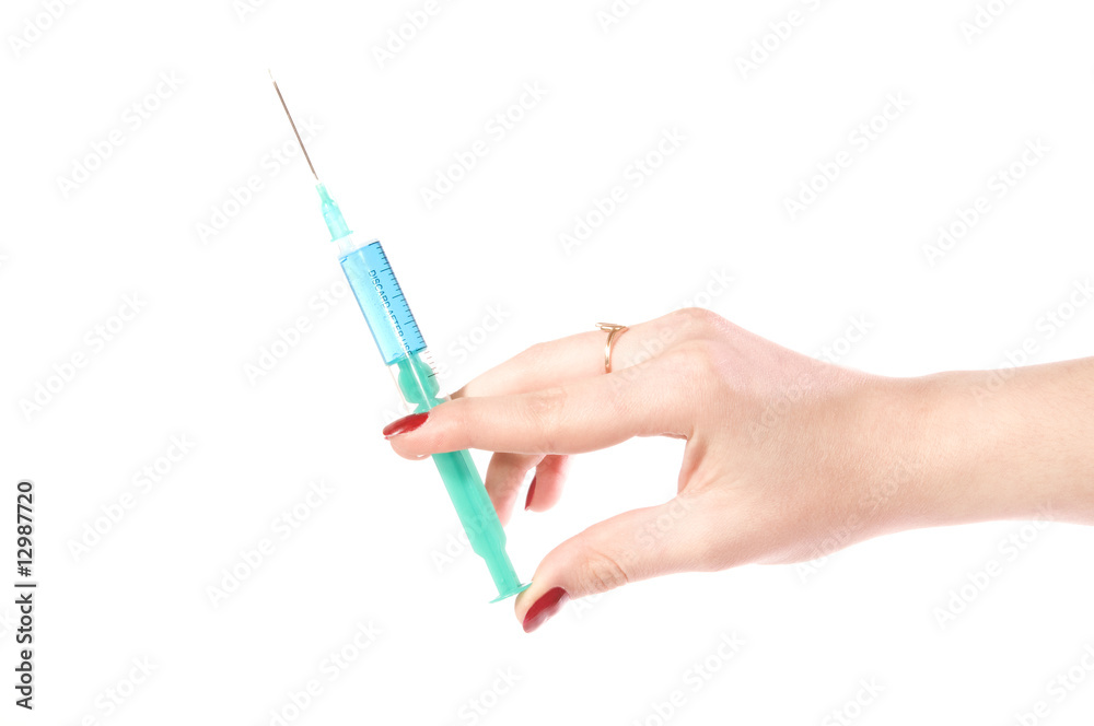 Hand with a syringe Hand with a syringe