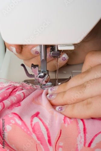 sewing pink on a machine