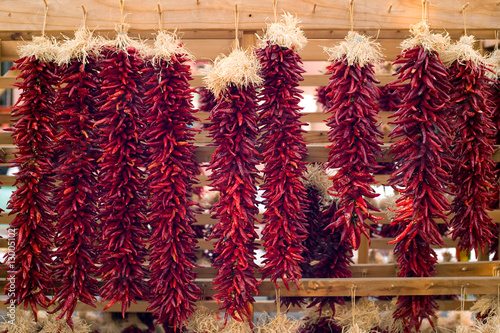 Chili peppers hanging on Santa Fe marketplace, New Mexico photo