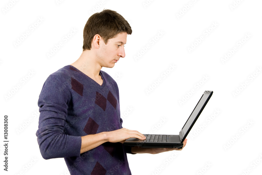 Young man is surprised about what he sees on his laptop. Isolate Young man is surprised about what he sees on his laptop. Isolate