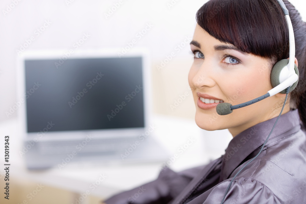 Female operator talking on headset Female operator talking on headset