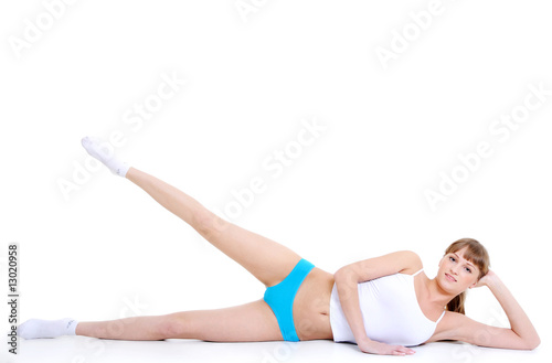 girl doing fitness lying on the floor