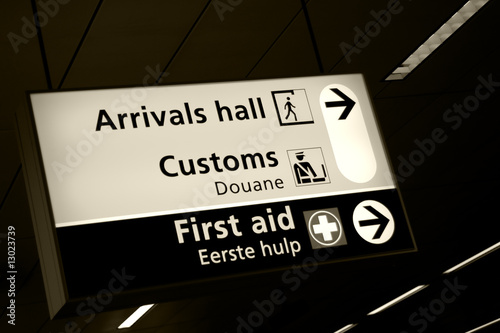Directional sign in arrivals hall of Amsterdam airport
