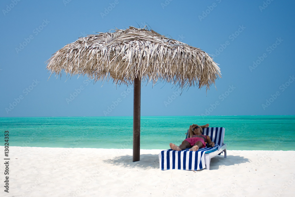 Beautiful woman lying  at tropical beach