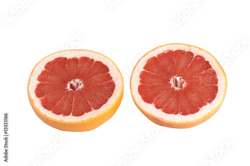 Juicy pieces of grapefruit on a white.