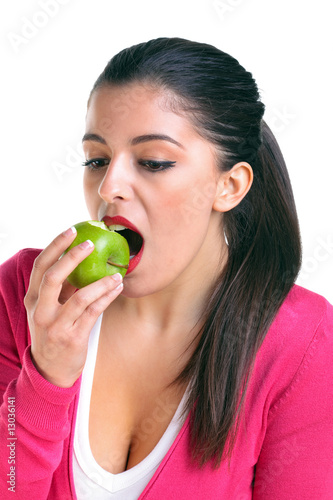 Woman eating a green apple
