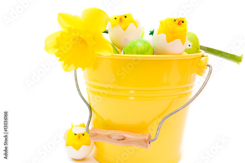 colorful easter eggs in bucket isolated on white © anna karwowska