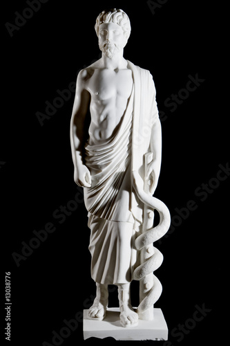 White marble classic statue of Asclepius isolated on black photo