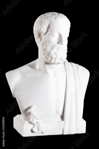 Classical white marble bust of Hippocrates isolated on black photo