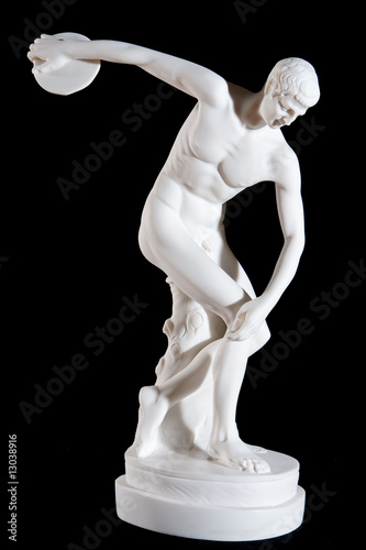 white marble statue of naked discus thrower isolated on black