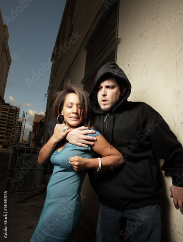Woman elbowing a man who was trying to assault the woman