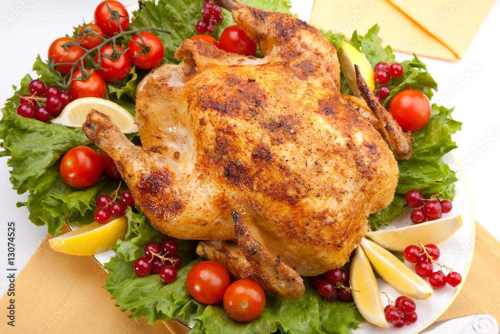 Whole roasted chicken on table Whole roasted chicken on table